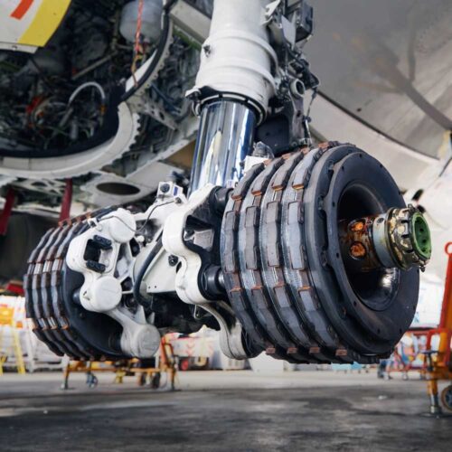 Aeroplane braking systems deployed when parled for servicing.